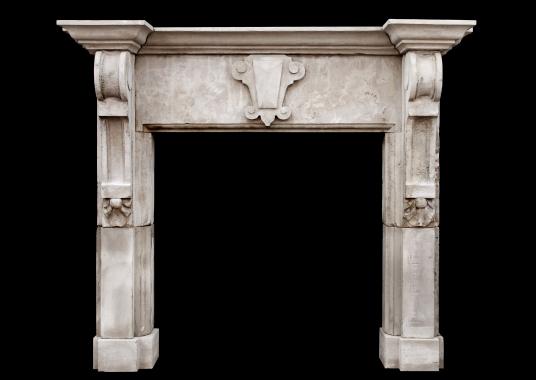 A large limestone fireplace with shaped brackets (pair available)