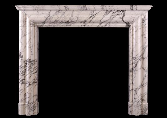 An architectural fireplace in Arabescato marble