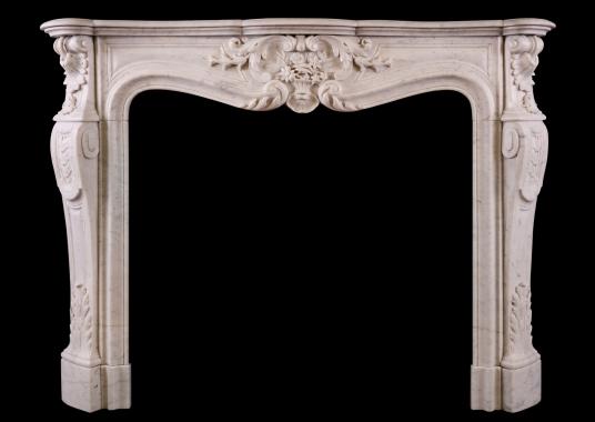 A Carrara marble fireplace in the Louis XV style