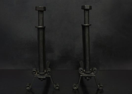 A pair of cast iron firedogs