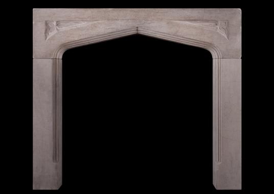 A limestone fireplace in the Gothic manner