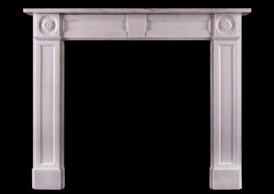 A white marble fireplace in the Regency style