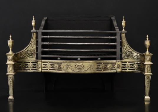 A Georgian style brass fire basket