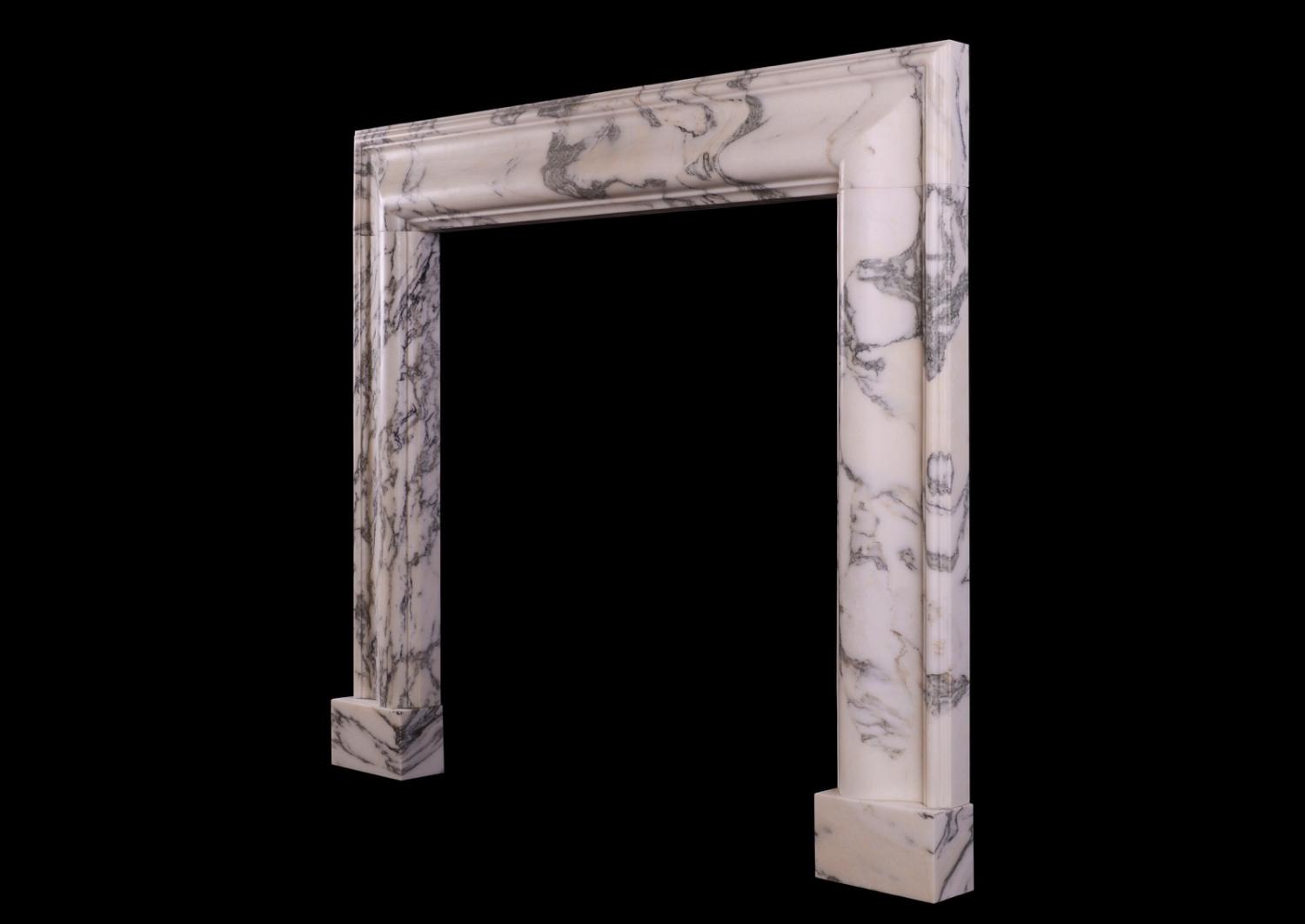 An English moulded bolection fireplace in Italian Arabescato marble