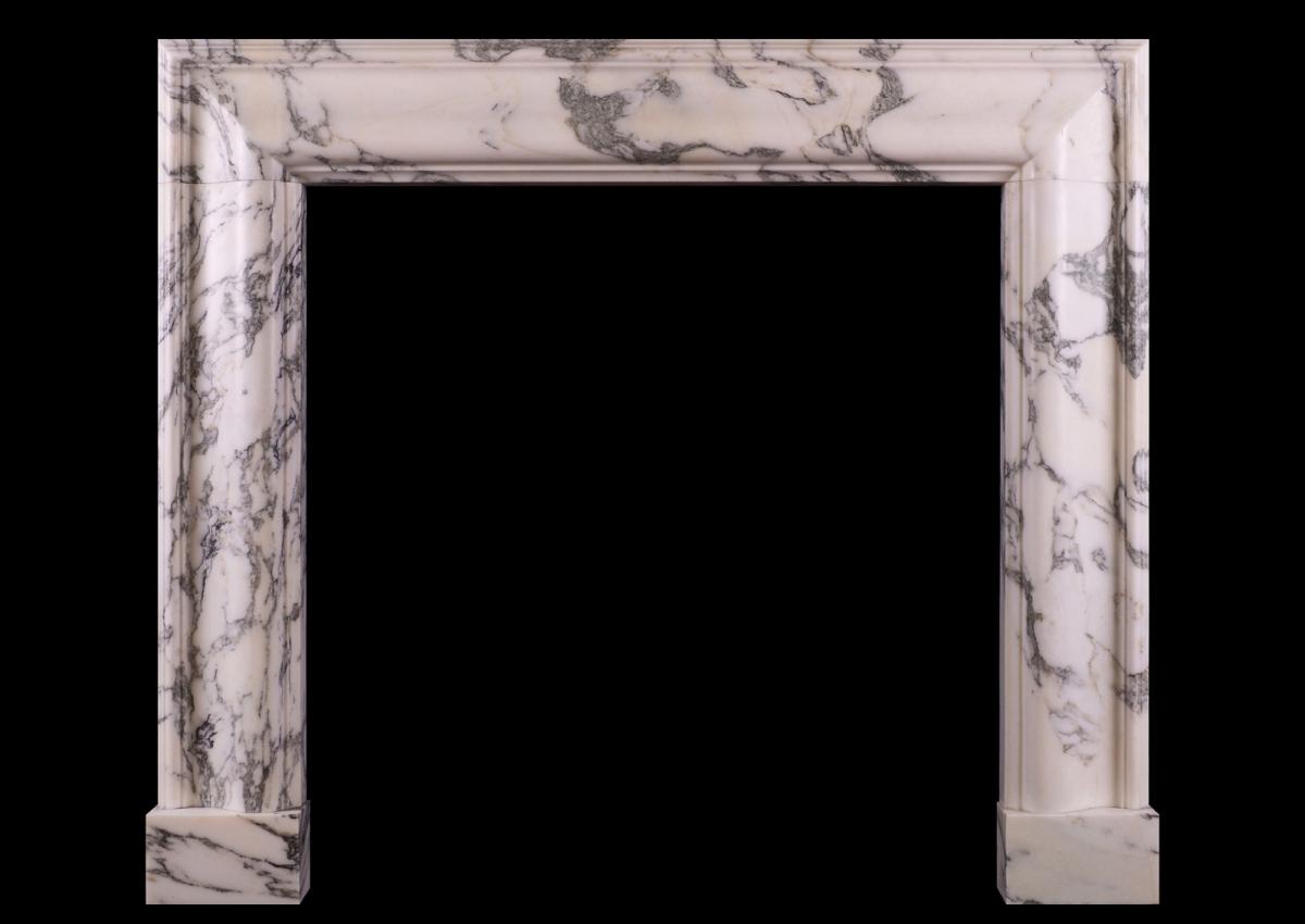 An English moulded bolection fireplace in Italian Arabescato marble
