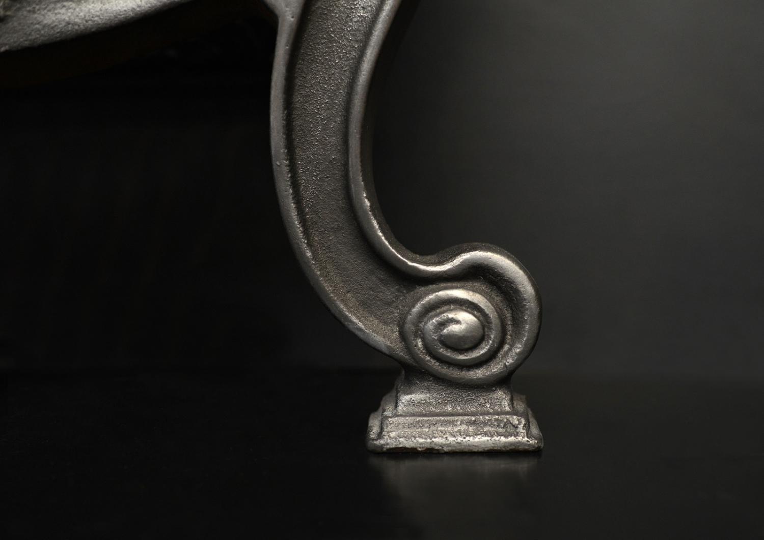 A polished cast iron Adam style basket