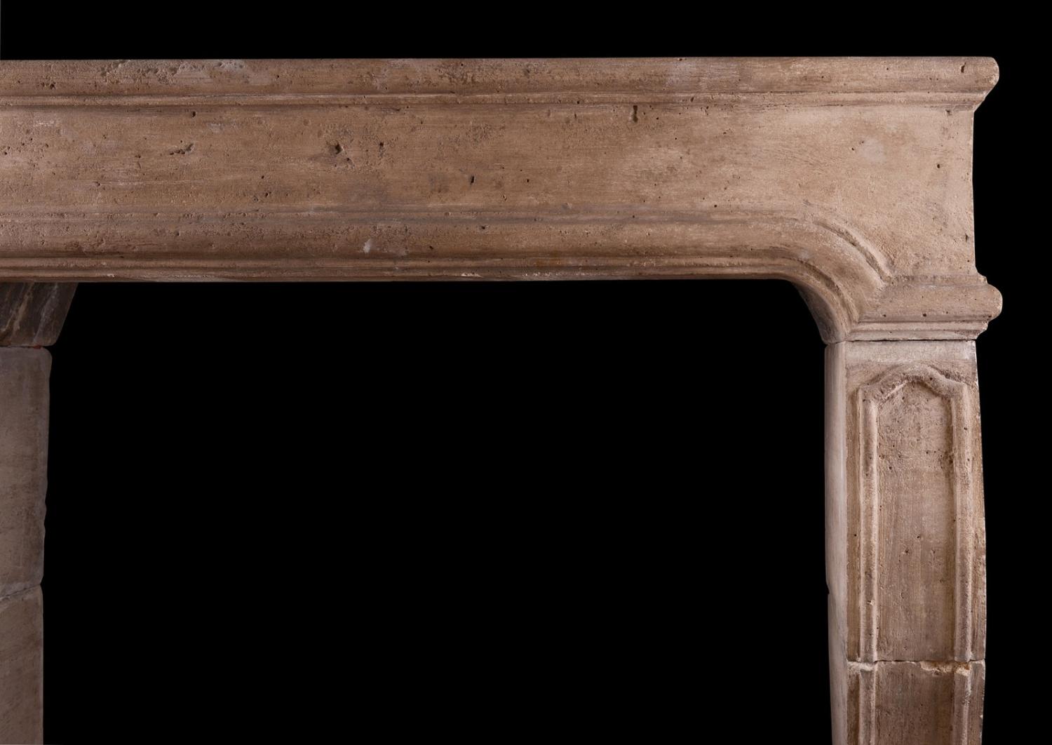 A period French Louis XIV limestone fireplace