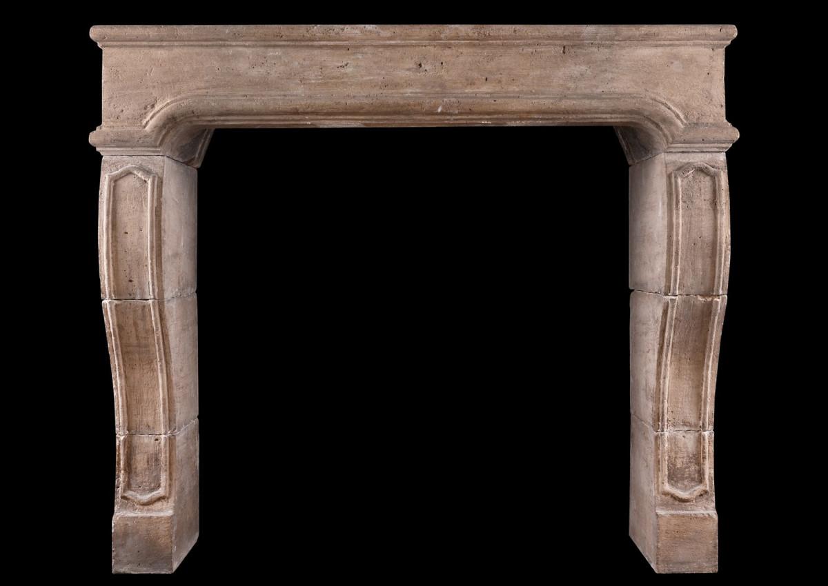 A period French Louis XIV limestone fireplace