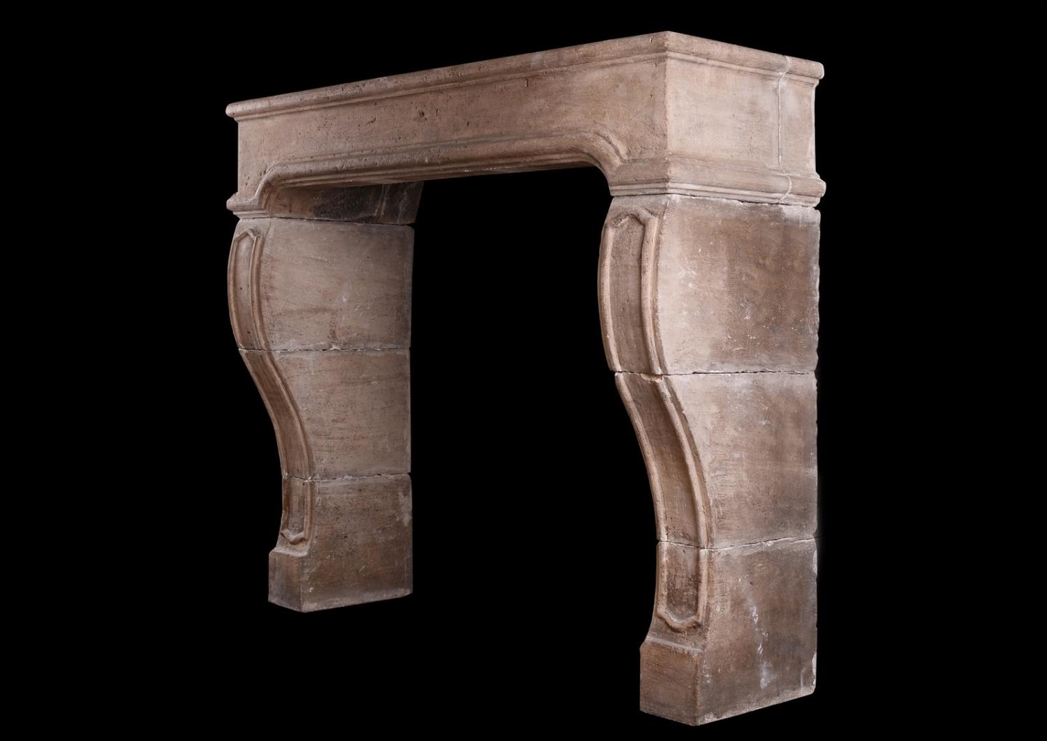 A period French Louis XIV limestone fireplace
